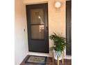 Charming front entrance with modern black door and lovely 