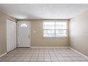 Spacious room showcasing the neutral interior and tile floors at 3207 N 45Th St, Tampa, FL 33605