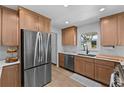 Modern kitchen with stainless steel appliances, wood cabinets, and light countertops at 1767 Colorado Ne Ave, St Petersburg, FL 33703