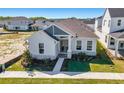 Bright single-story home featuring well-manicured lawn, stone accents, and concrete walkway at 3603 Lajuana Blvd, Wesley Chapel, FL 33543