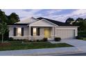Inviting single-story home with a manicured lawn and a convenient two-car garage at 22492 Provance Ave, Port Charlotte, FL 33954