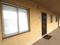 Condo entrance featuring unit 327, neutral paint, a secure door, and a welcome mat at 3672 Lake Bayshore Dr # K327, Bradenton, FL 34205