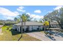 Single-story duplex featuring a well-manicured lawn and a convenient shared driveway at 1618 39Th Avenue E Dr, Ellenton, FL 34222