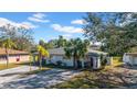 Single-story duplex with manicured lawn and shared driveway at 1618 39Th Avenue E Dr, Ellenton, FL 34222