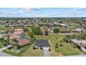 Sprawling community featuring well maintained homes, manicured lawns, and tropical palm trees at 218 Soursop, Punta Gorda, FL 33955