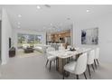 Open concept living area with modern furnishings, sleek lighting, and kitchen with island at 218 Soursop, Punta Gorda, FL 33955
