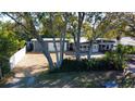 A lovely exterior view of home showcasing the landscaping, driveway, and welcoming facade at 10952 61St Ave, Seminole, FL 33772