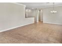 Bright living room featuring neutral walls and tile floors with an adjacent dining area at 5485 Sunset Falls Dr, Apollo Beach, FL 33572
