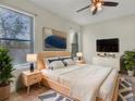 Serene main bedroom showcasing natural light, comfortable bedding, and tasteful decorations at 5485 Sunset Falls Dr, Apollo Beach, FL 33572