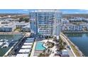 Modern high-rise building with a pool, patio, and marina access, perfect for luxury living at 5120 Marina Way # 12003, Tampa, FL 33611