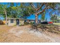 Inviting single-story home showcasing mature trees and a neatly kept lawn in a desirable location at 10151 114Th N Ter, Largo, FL 33773
