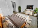 Bright bedroom with light wood floors, modern furniture, and neutral decor for a calming atmosphere at 110 Lakeside Colony Dr, Tarpon Springs, FL 34689