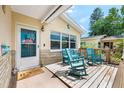 The front porch is decorated with rocking chairs and a welcome mat at 1810 New Hampshire Ne Ave, St Petersburg, FL 33703