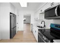 Stylish kitchen with stainless steel appliances, sleek cabinetry, and a functional layout at 11200 102Nd Ave # 74, Seminole, FL 33778