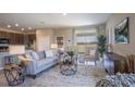 Inviting living room with stylish furniture, neutral tones, and natural light, creating a cozy atmosphere at 15475 Maynard Ave, Port Charlotte, FL 33953