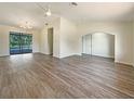 Bright, open living room featuring hard surface flooring and abundant natural light at 18284 Yale Ave, Port Charlotte, FL 33948