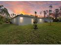 Expansive backyard with lush green grass, perfect for outdoor activities and enjoying the serene surroundings at 24349 Kingsway Cir, Punta Gorda, FL 33983