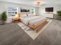 Spacious main bedroom with large bed, stylish decor, and bright natural light from multiple windows at 32100 Pop Ash Pl, San Antonio, FL 33576