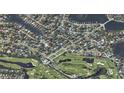 Aerial view of property in a neighborhood near a golf course and a lake at 515 Snell Isle Ne Blvd, St Petersburg, FL 33704