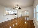 Open-concept living room with hardwood floors, seamlessly connected to the kitchen at 3025 W North A St, Tampa, FL 33609