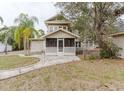 View of home with an enclosed screened in porch and mature trees at 8226 36Th N Ave, St Petersburg, FL 33710