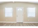 Inviting living room with ample natural light and new wood-look flooring at 3720 E Idlewild Ave, Tampa, FL 33610