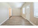 Open living area with neutral walls and stylish wood-look floors throughout at 3720 E Idlewild Ave, Tampa, FL 33610