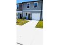 Charming two-story townhome with a one-car garage and well-maintained lawn at 11856 Throttle Pl, Gibsonton, FL 33534