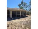 Enclosed screened patio, offering a perfect blend of indoor-outdoor living at 12403 Snowy Egret Ave, Weeki Wachee, FL 34614