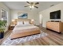 Spacious main bedroom with stylish decor, a ceiling fan, and a walk-in closet at 3527 65Th Avenue E Cir, Sarasota, FL 34243