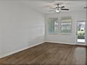 Bright, unfurnished living room with hardwood floors, ceiling fan, and natural light at 10039 Ivory Dr, Sun City Center, FL 33573