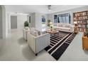 Bright living room with striped chairs, a stylish rug, and plenty of natural light at 1540 David Pl, Englewood, FL 34223