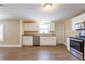 Modern kitchen featuring stainless steel appliances, granite countertops, and ample cabinet space at 3808 E 21St Ave, Tampa, FL 33605