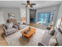 Comfortable living room with a fireplace, plush seating, and a sliding glass door leading to a patio at 557 Pinellas Bayway S # 111, St Petersburg, FL 33715