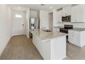 Modern kitchen with stainless steel appliances and a spacious island at 3561 Moscato Dr, Brooksville, FL 34602