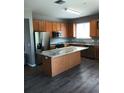 Spacious kitchen features stainless appliances and a center island at 6339 Magnolia Trails Ln, Gibsonton, FL 33534
