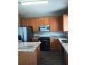 Spacious kitchen features stainless appliances and a center island at 6339 Magnolia Trails Ln, Gibsonton, FL 33534