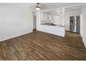 Spacious living area with wood-look tile flooring and ample natural light at 8340 75Th Pl, Seminole, FL 33777