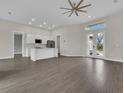This home features an open floor plan, seamlessly connecting living and kitchen areas at 15741 Autry Cir, Port Charlotte, FL 33981