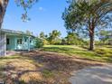 Spacious front yard and the home's attractive facade offer curb appeal at 5275 Miller Bayou Dr, Port Richey, FL 34668