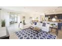 Bright living room with patio access, stylish decor and an open floorplan at 150 Castile Ct, Punta Gorda, FL 33983