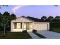 Charming single-story home featuring a two-car garage and well-maintained landscaping at 25880 Prada Dr, Punta Gorda, FL 33955