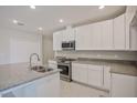 Well-equipped kitchen featuring granite countertops, stainless appliances, and ample storage at 25880 Prada Dr, Punta Gorda, FL 33955