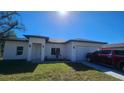 Inviting single-Gathering home with a two-car garage and a neatly kept lawn at 17065 Malta Ave Ave, Port Charlotte, FL 33954