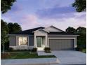 Charming single-story home with a two-car garage, enhanced by evening lighting at 25575 Calusa Dr, Punta Gorda, FL 33955