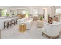 Bright living room with stylish furniture, neutral decor, and an open floor plan at 25575 Calusa Dr, Punta Gorda, FL 33955