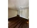 Spacious living room with wood floors at 6405 Gainsboro Dr, Port Richey, FL 34668
