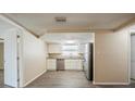 Bright kitchen with stainless steel appliances, granite countertops, and new cabinets at 9811 Rainbow Ln, Port Richey, FL 34668
