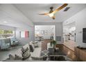 Bright and spacious living room featuring a modern ceiling fan and an open floor plan at 1206 E Hamilton Ave, Tampa, FL 33604