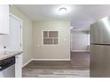 Bright kitchen with granite countertops, stainless steel appliances, and wood-look floors at 6730 32Nd N Ave, St Petersburg, FL 33710